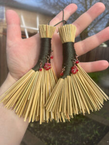 pic 1 hand with both brooms